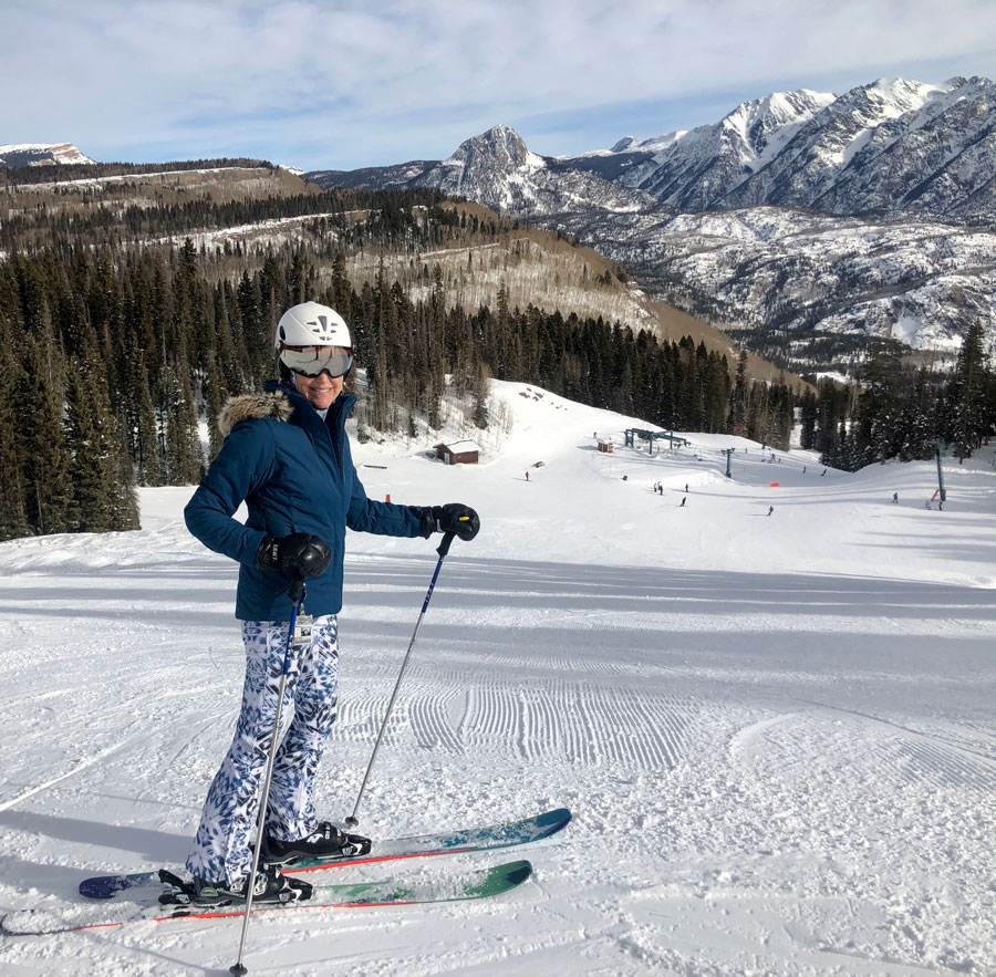 woman on skis in the mountains